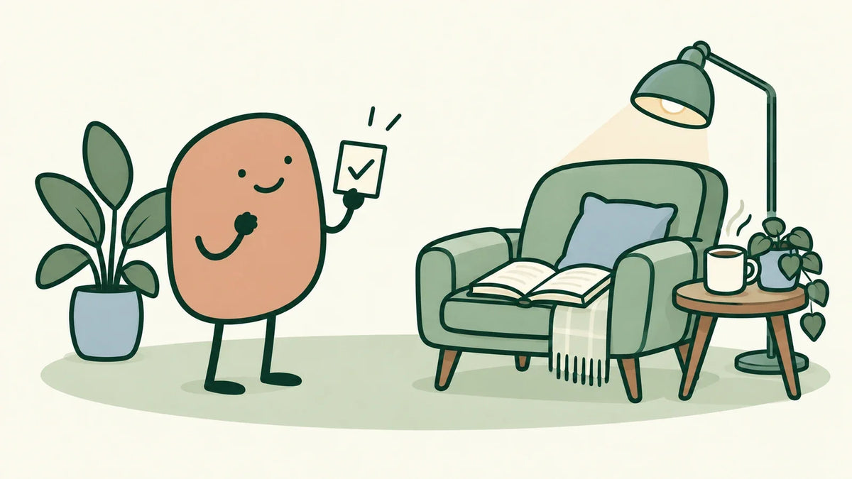 A terracotta character holds a checkmark card beside a reading chair with an open book and lamp.